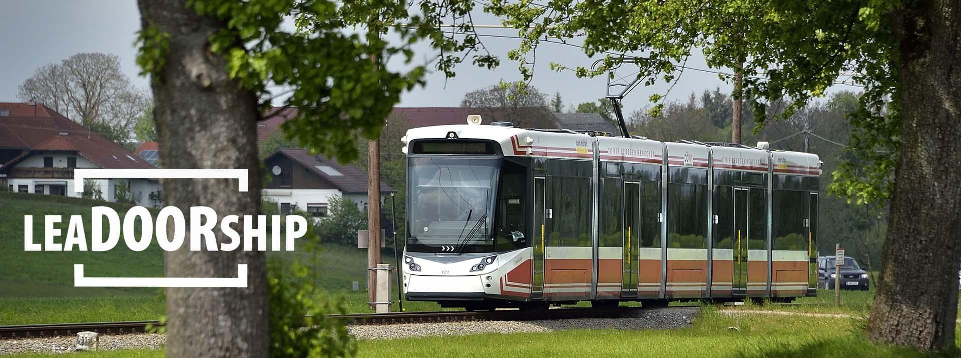 Tram in green urban environment