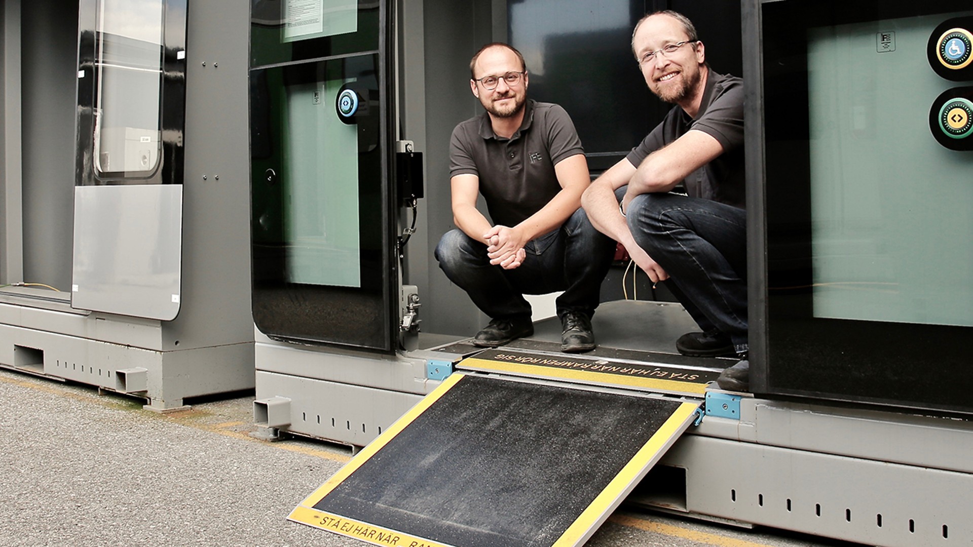 Career Banner - Two employees in front of an IFE access device