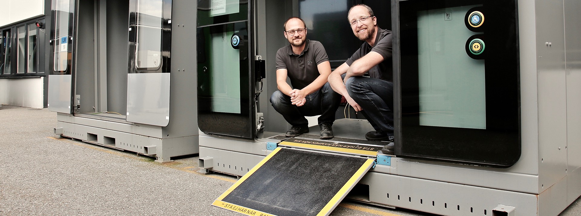 Career Banner - Two employees in front of an IFE access device