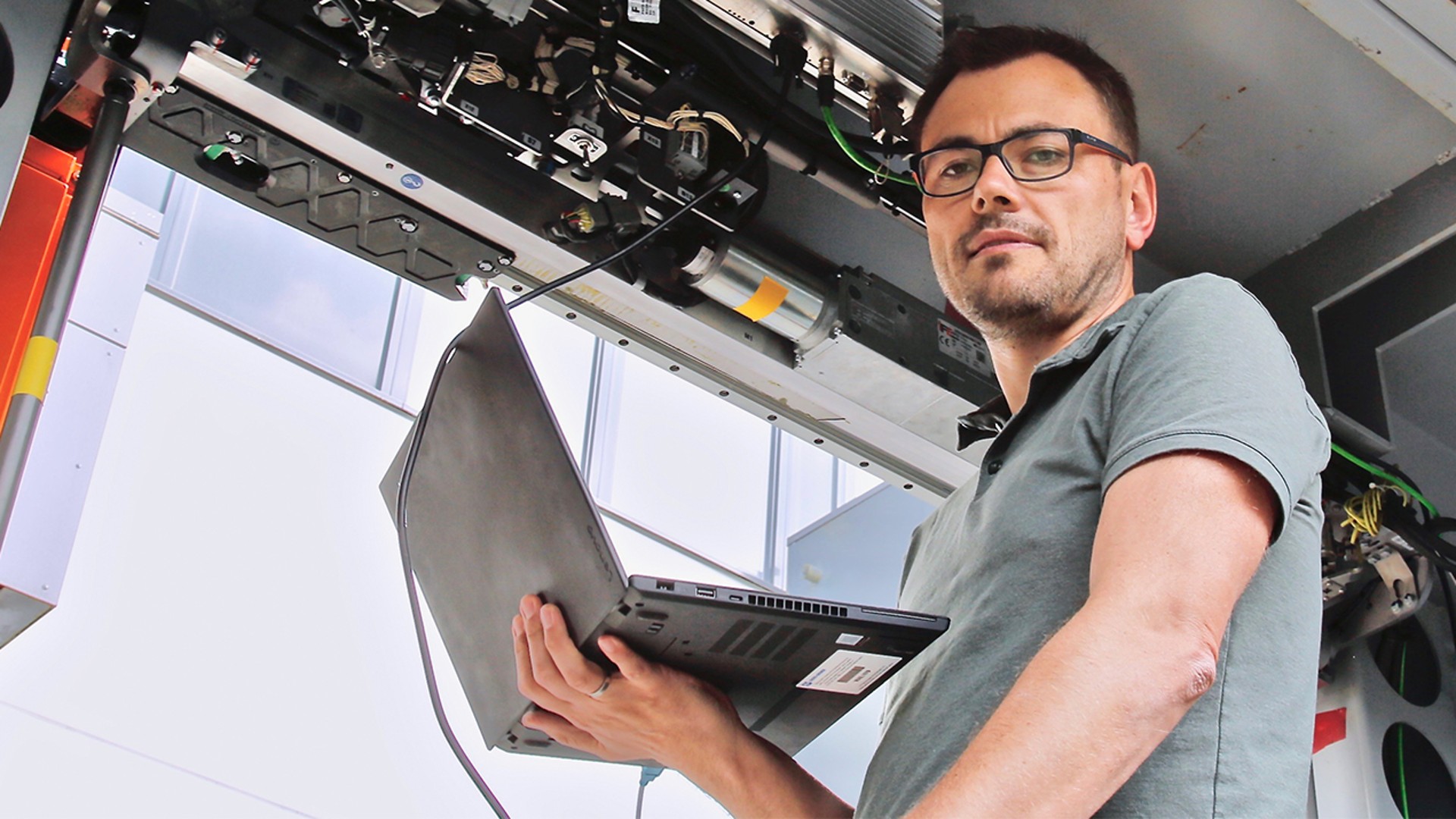 Career Banner - Employee checking the door system with his laptop